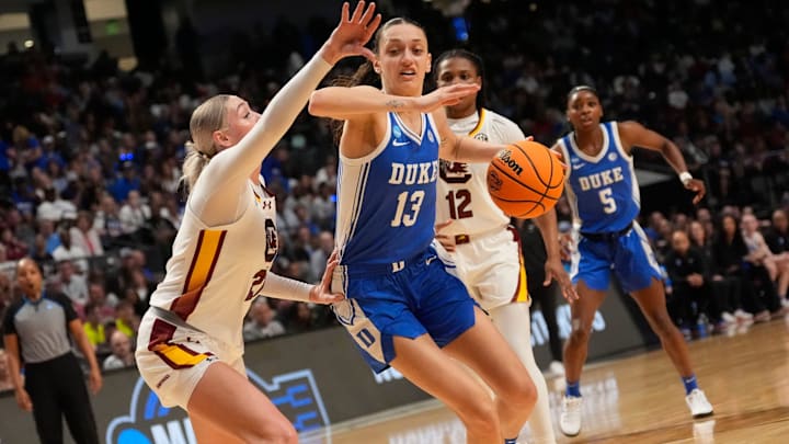 Mar 30, 2025; Birmingham, AL, USA; Duke Blue Devils forward Jordan Wood (13) drives against South Carolina Gamecocks forward Chloe Kitts (21) at Legacy Arena. Mandatory Credit: Gary Cosby Jr.-Tuscaloosa News