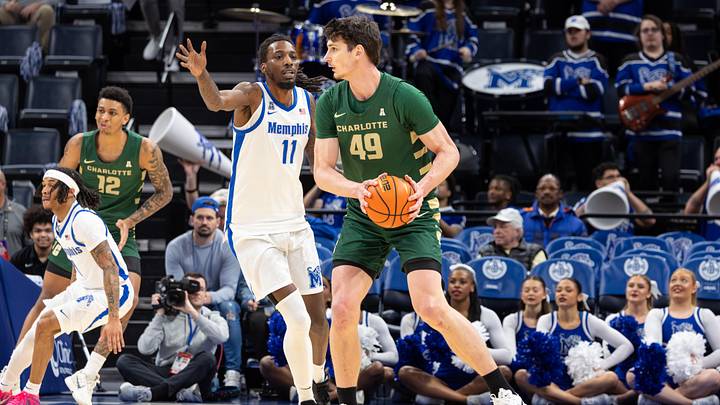 Feb 8, 2026; Memphis, Tennessee, USA; Charlotte 49ers center Anton Bonke (49) handles the ball against Memphis Tigers forward Aaron Bradshaw (11) during the first half at FedExForum. Mandatory Credit: Wesley Hale-Imagn Images Feb 8, 2026; Memphis, Tennessee, USA; Charlotte 49ers center Anton Bonke (49) handles the ball against Memphis Tigers forward Aaron Bradshaw (11) during the first half at FedExForum. Mandatory Credit: Wesley Hale-Imagn Images