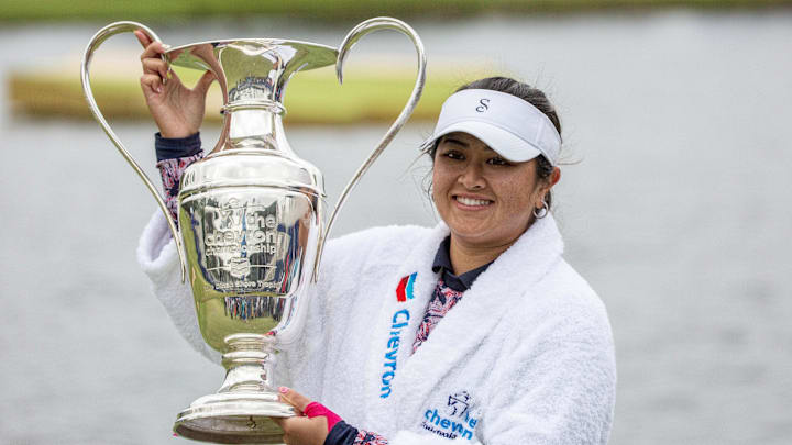Apr 23, 2023; The Woodlands, Texas, USA;  Lilia Vu (USA) holds the Dinah Shore trophy after winning