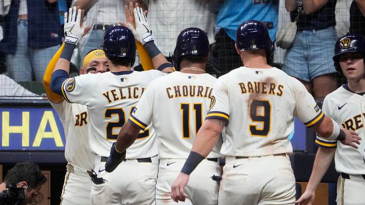 Aug 18, 2026; Milwaukee, Wisconsin, USA; Milwaukee Brewers catcher William Contreras (24) congratulates designated hitter Christian Yelich (22) after hitting a home run against the Seattle Mariners in the fifth inning at American Family Field. Mandatory Credit: Michael McLoone-Imagn Images