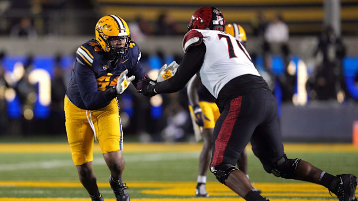 Xavier Carlton, left, is third in the ACC with nine sacks.
