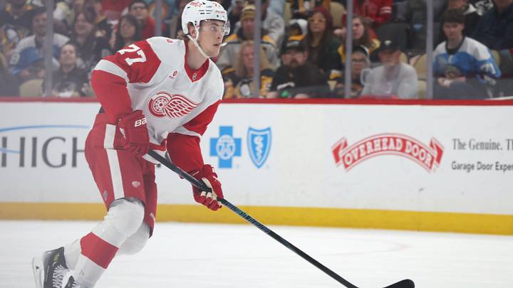 Mar 31, 2026; Pittsburgh, Pennsylvania, USA;  Detroit Red Wings defenseman Simon Edvinsson (77) moves the puck against the Pittsburgh Penguins during the second period at PPG Paints Arena. Mandatory Credit: Charles LeClaire-Imagn Images