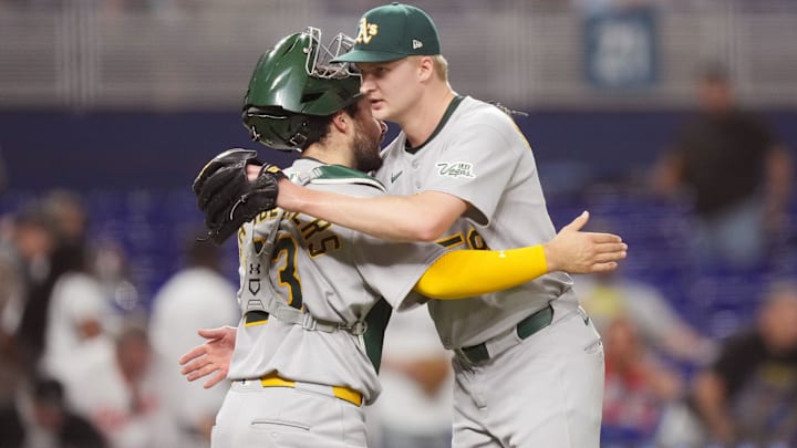 May 2, 2025; Miami, Florida, USA; Oakland Athletics pitcher Noah Murdock (58) congratulates catcher Shea Langeliers (23) on a victory against the Miami Marlins at loanDepot Park. Mandatory Credit: Jim Rassol-Imagn Images May 2, 2025; Miami, Florida, USA; Oakland Athletics pitcher Noah Murdock (58) congratulates catcher Shea Langeliers (23) on a victory against the Miami Marlins at loanDepot Park. Mandatory Credit: Jim Rassol-Imagn Images