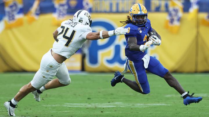 Sep 12, 2026; Pittsburgh, Pennsylvania, USA;  Pittsburgh Panthers wide receiver Cataurus Hicks (3) returns a punt against UCF Knights linebacker Tackett Curtis (24) during the second quarter at Acrisure Stadium.  Mandatory Credit: Charles LeClaire-Imagn Images