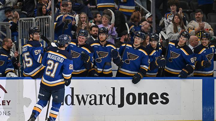Apr 13, 2026; St. Louis, Missouri, USA; St. Louis Blues right wing Jimmy Snuggerud (21) is congratulated after scoring an empty net goal against the Minnesota Wild in the third period at Enterprise Center. Mandatory Credit: Joe Puetz-Imagn Images