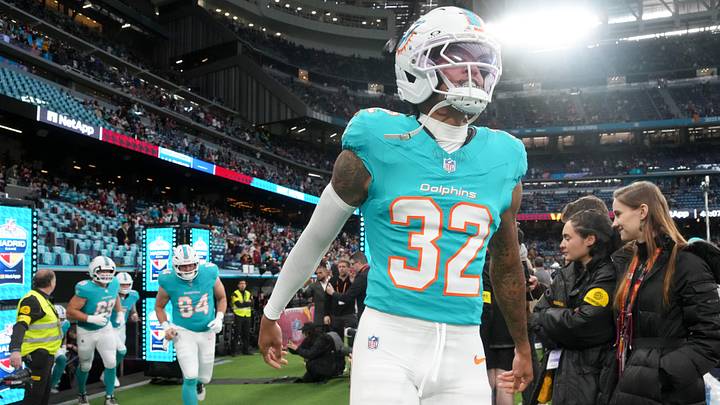 Miami Dolphins cornerback JuJu Brents (32) runs onto the field prior to the 2025 NFL Madrid Game against the Washington Commanders at Santiago Bernabeu Stadium.