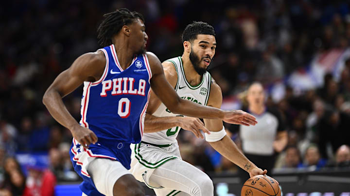 Nov 8, 2023; Philadelphia, Pennsylvania, USA; Boston Celtics forward Jayson Tatum (0) drives against Philadelphia 76ers guard Tyrese Maxey (0) in the first quarter at Wells Fargo Center. Mandatory Credit: Kyle Ross-Imagn Images