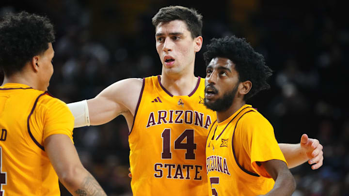 Arizona State forward Andrija Grbović (14) gathers Bryce Ford (4) and Moe Odum (5) during a game against Cincinnati at Desert Financial Arena in Tempe, Ariz., on Jan. 24, 2026.
