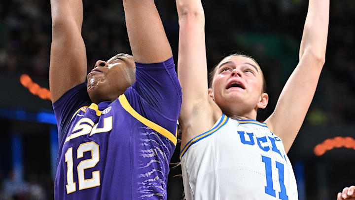 Mar 30, 2025; Spokane, WA, USA; LSU Lady Tigers guard Mikaylah Williams (12) rebounds against UCLA Bruins guard Gabriela Jaquez (11) during the first half of a Elite 8 NCAA Tournament basketball game at Spokane Arena. Mandatory Credit: James Snook-Imagn Images Mar 30, 2025; Spokane, WA, USA; LSU Lady Tigers guard Mikaylah Williams (12) rebounds against UCLA Bruins guard Gabriela Jaquez (11) during the first half of a Elite 8 NCAA Tournament basketball game at Spokane Arena. Mandatory Credit: James Snook-Imagn Images