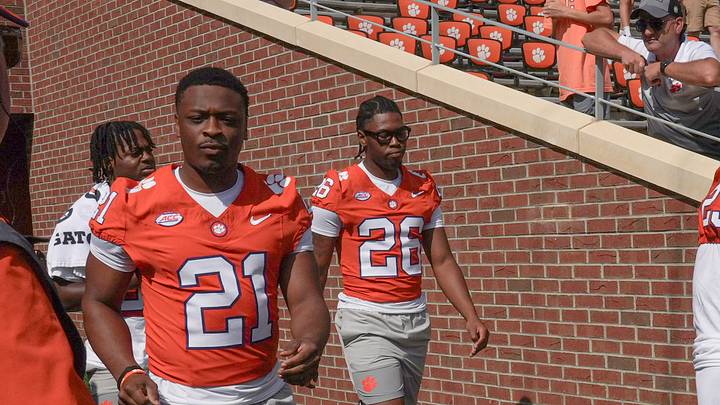 Clemson running backs Jay Haynes (26) and Jarvis Green (21) formed a strong bond after being away from the field. Clemson running backs Jay Haynes (26) and Jarvis Green (21) formed a strong bond after being away from the field.