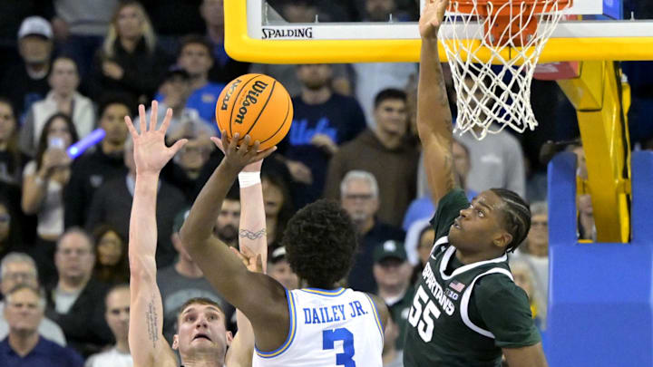 Feb 4, 2025; Los Angeles, California, USA; UCLA Bruins guard Eric Dailey Jr. (3) shoots the winning basket over Michigan State Spartans center Carson Cooper (15) and forward Coen Carr (55) in the second half at Pauley Pavilion presented by Wescom. Mandatory Credit: Jayne Kamin-Oncea-Imagn Images Feb 4, 2025; Los Angeles, California, USA; UCLA Bruins guard Eric Dailey Jr. (3) shoots the winning basket over Michigan State Spartans center Carson Cooper (15) and forward Coen Carr (55) in the second half at Pauley Pavilion presented by Wescom. Mandatory Credit: Jayne Kamin-Oncea-Imagn Images