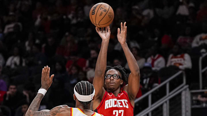 Oct 16, 2025; Atlanta, Georgia, USA; Houston Rockets forward Isaiah Crawford (27) shoots over Atlanta Hawks shooting guard Nickeil Alexander-Walker (7) during the second half at State Farm Arena. Mandatory Credit: Dale Zanine-Imagn Images Oct 16, 2025; Atlanta, Georgia, USA; Houston Rockets forward Isaiah Crawford (27) shoots over Atlanta Hawks shooting guard Nickeil Alexander-Walker (7) during the second half at State Farm Arena. Mandatory Credit: Dale Zanine-Imagn Images