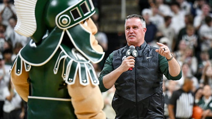 Michigan State's new football coach Pat Fitzgerald addresses the crowd during a timeout in the first half of the Spartans basketball game against Iowa on Tuesday, Dec. 2, 2025, at the Breslin Center in East Lansing. Michigan State's new football coach Pat Fitzgerald addresses the crowd during a timeout in the first half of the Spartans basketball game against Iowa on Tuesday, Dec. 2, 2025, at the Breslin Center in East Lansing.