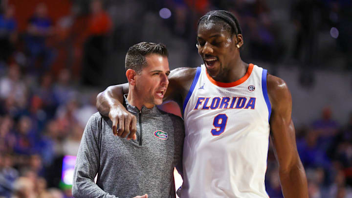Florida center Rueben Chinyelu (9) talks with Florida head coach Todd Golden as he comes off court during the second half of a NCAA mens basketball game against South Carolina at Steven C. O'Connell Center Exactek arena in Gainesville, FL on Tuesday, February 17, 2026. [Alan Youngblood/Gainesville Sun]