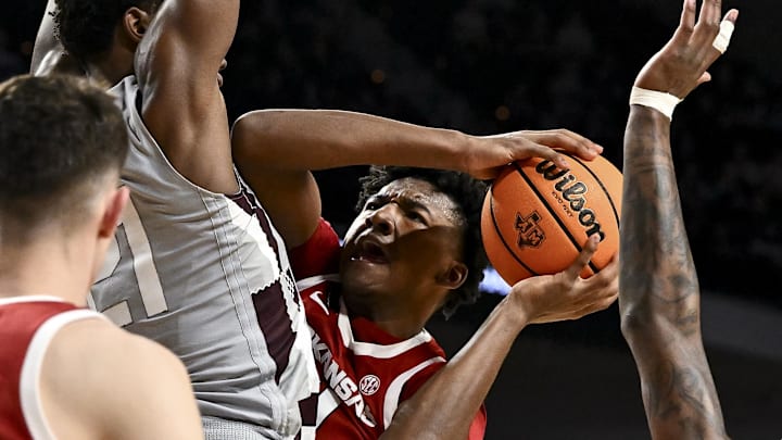 Arkansas Razorbacks forward Karter Knox (11) attempts to shoot the ball as Texas A&M Aggies forward Pharrel Payne (21) defends during the second half at Reed Arena.