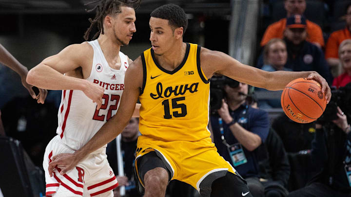 Mar 11, 2022; Indianapolis, IN, USA; Iowa Hawkeyes forward Keegan Murray (15) dribbles the ball while Rutgers Scarlet Knights guard Caleb McConnell (22) defends in the second half at Gainbridge Fieldhouse. Mandatory Credit: Trevor Ruszkowski-Imagn Images Mar 11, 2022; Indianapolis, IN, USA; Iowa Hawkeyes forward Keegan Murray (15) dribbles the ball while Rutgers Scarlet Knights guard Caleb McConnell (22) defends in the second half at Gainbridge Fieldhouse. Mandatory Credit: Trevor Ruszkowski-Imagn Images