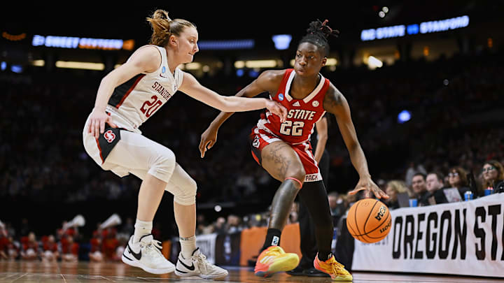 Mar 29, 2024; Portland, OR, USA; NC State Wolfpack guard Saniya Rivers (22) drives to the basket during the first half against Stanford Cardinal guard Elena Bosgana (20) in the semifinals of the Portland Regional of the 2024 NCAA Tournament at the Moda Center at the Moda Center. Mandatory Credit: Troy Wayrynen-Imagn Images Mar 29, 2024; Portland, OR, USA; NC State Wolfpack guard Saniya Rivers (22) drives to the basket during the first half against Stanford Cardinal guard Elena Bosgana (20) in the semifinals of the Portland Regional of the 2024 NCAA Tournament at the Moda Center at the Moda Center. Mandatory Credit: Troy Wayrynen-Imagn Images