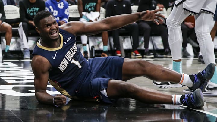 New Orleans Pelicans forward Zion Williamson (1) reacts after getting knocked to the floor in the second quarter against the Brooklyn Nets at Barclays Center. Mandatory Credit: Wendell Cruz-Imagn Images