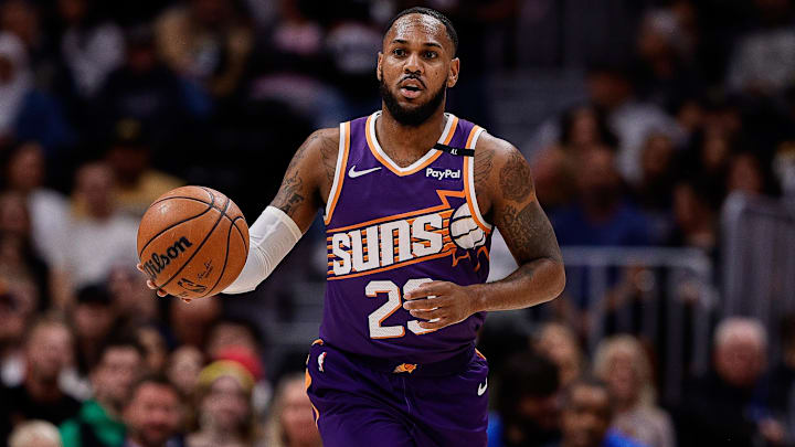 Oct 13, 2024; Denver, Colorado, USA; Phoenix Suns guard Monte Morris (23) dribbles the ball up court in the first quarter against the Denver Nuggets at Ball Arena. Mandatory Credit: Isaiah J. Downing-Imagn Images