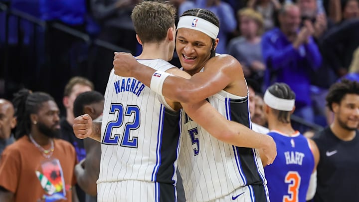 Dec 29, 2023; Orlando, Florida, USA; Orlando Magic forward Franz Wagner (22) and forward Paolo Banchero (5) celebrate their 117-108 win against the New York Knicks at KIA Center. Mandatory Credit: Mike Watters-Imagn Images