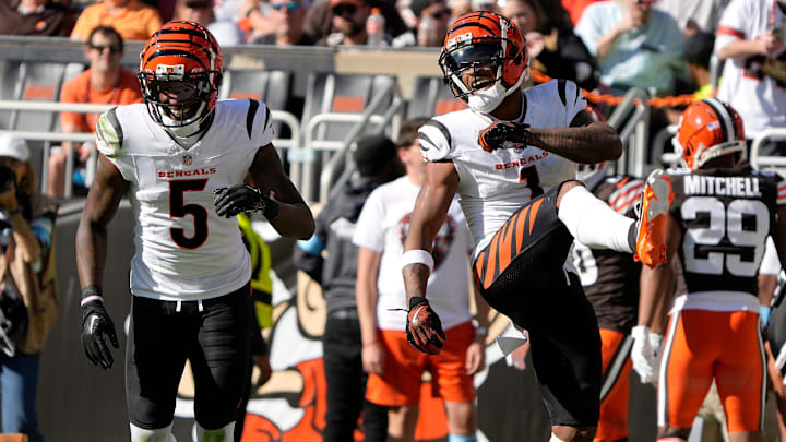 Cincinnati Bengals wide receiver Tee Higgins (5) and Bengals wide receiver Ja'Marr Chase (1) celebrate Chase touchdown in the 3rd quarter over the Cleveland Browns in the NFL Week 7 game at Huntington Bank Field in Cleveland October 20, 2024. The Bengals won 21-14.. Cincinnati Bengals wide receiver Tee Higgins (5) and Bengals wide receiver Ja'Marr Chase (1) celebrate Chase touchdown in the 3rd quarter over the Cleveland Browns in the NFL Week 7 game at Huntington Bank Field in Cleveland October 20, 2024. The Bengals won 21-14..