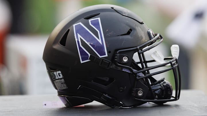 Nov 11, 2023; Madison, Wisconsin, USA;  General view of a Northwestern Wildcats helmet on the sidelines during the game against the Wisconsin Badgers at Camp Randall Stadium. Mandatory Credit: Jeff Hanisch-Imagn Images