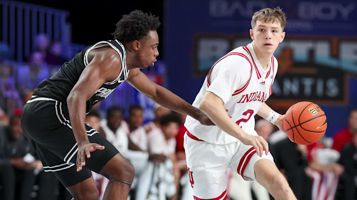Indiana Hoosiers guard Gabe Cupps (2) dribbles as Providence Friars guard Bensley Joseph (7) defends during the first half at Imperial Arena at the Atlantis resort. 
