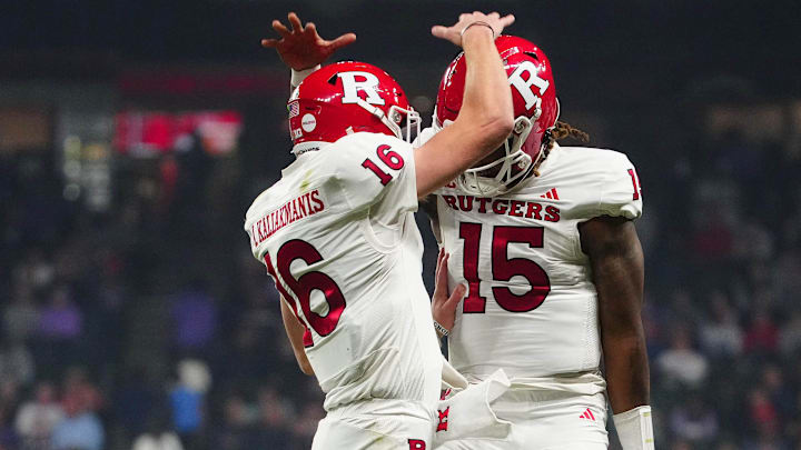 Rutgers quarterback Athan Kaliakmanis (16) celebrates a touchdown against Kansas State during second half of the Rate Bowl at Chase Field on Dec. 26, 2024, in Phoenix.