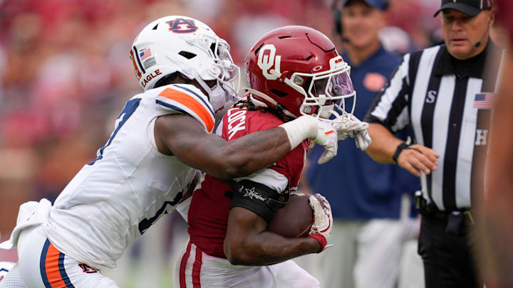 Oklahoma Sooners running back Tory Blaylock (6) is pushed out by Auburn Tigers linebacker Xavier Atkins (17) after a reception during a college football game between the University of Oklahoma Sooners (OU) and the Auburn Tigers at Gaylord Family Ð Oklahoma Memorial Stadium in Norman, Okla., Saturday,Sept. 20, 2025. Oklahoma won 24-17.