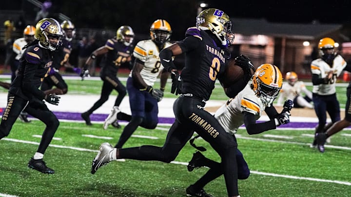 Booker's Chauncey Kennon runs upfield during the Class 3A-Region 3 Final against Boca Ciega in Sarasota on Friday, Nov. 29, 2024. Booker won 41-6.