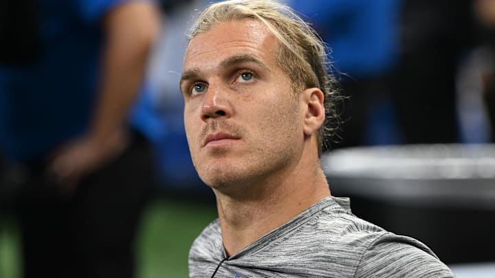 Aug 16, 2025; Detroit, Michigan, USA; Detroit Lions linebacker Alex Anzalone (34) watches the action from the bench during their preseason game against the Miami Dolphins at Ford Field.