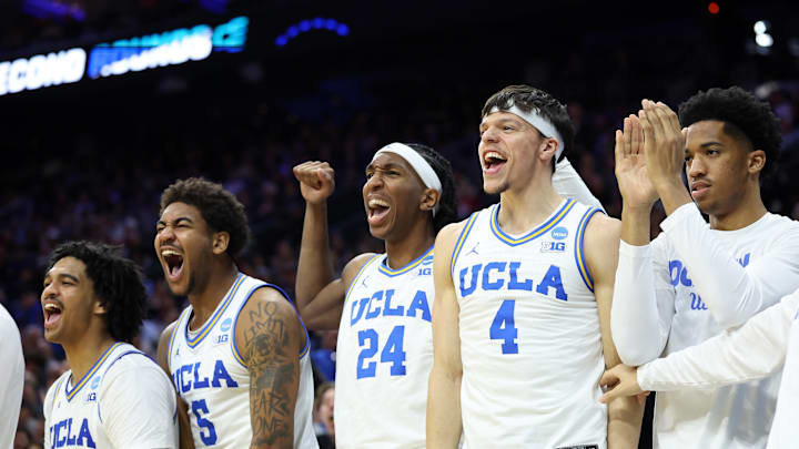 Mar 20, 2026; Philadelphia, PA, USA; UCLA Bruins guard Skyy Clark (55), guard Brandon Williams (5), center Steven Jamerson II (24), and  guard Jamar Brown (4) react on the bench in the second half during a first round game of the men's 2026 NCAA Tournament at Xfinity Mobile Arena. Mandatory Credit: Bill Streicher-Imagn Images