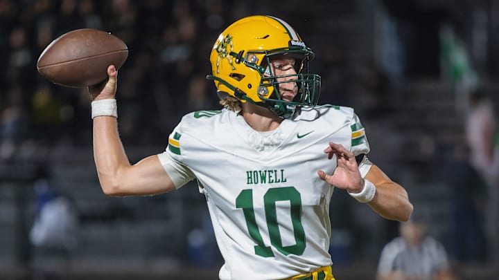 Howell's Preston Barb tosses his lone pass of the first half during a victory over Novi Friday, Oct. 11, 2024.