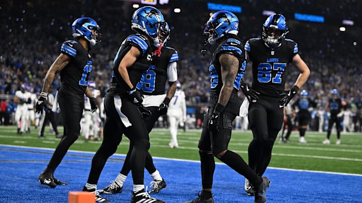 Detroit Lions running back Jahmyr Gibbs (26) celebrates with wide receivers Amon-Ra St. Brown (14), Tim Patrick (17) and Jameson Williams (9) and tight end Sam LaPorta (87) in the end zone after running for a touchdown against the Minnesota Vikings in the first quarter at Ford Field. 