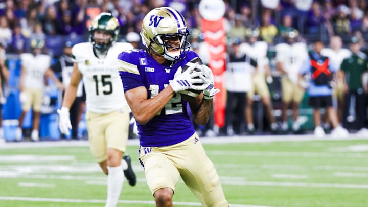 Aug 30, 2025; Seattle, Washington, USA; Washington Huskies wide receiver Denzel Boston (12) catches a pass against the Colorado State Rams during the second quarter at Husky Stadium. Mandatory Credit: Joe Nicholson-Imagn Images