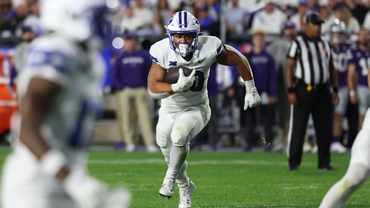 Sep 21, 2024; Provo, Utah, USA; Brigham Young Cougars running back Sione I Moa (30) runs the ball for a touchdown against the Kansas State Wildcats during the fourth quarter at LaVell Edwards Stadium.