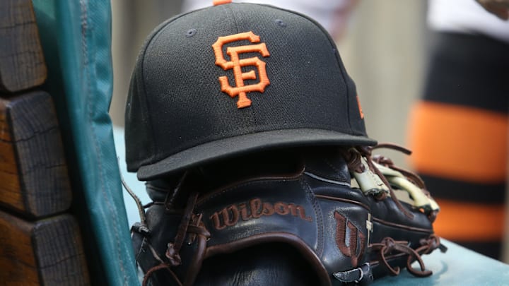 Jul 14, 2023; Pittsburgh, Pennsylvania, USA;  San Francisco Giants hat and glove on the bench against the Pittsburgh Pirates during the first inning at PNC Park.