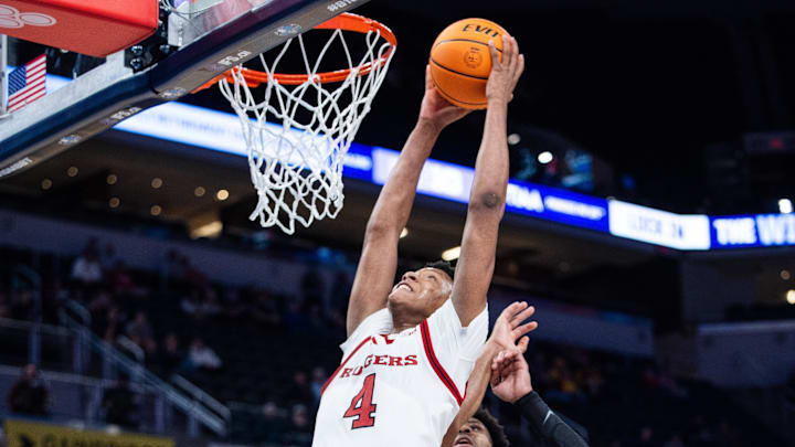 Mar 12, 2025; Indianapolis, IN, USA; Rutgers Scarlet Knights guard Ace Bailey (4) shoots the ball while USC Trojans guard Chibuzo Agbo (7) defends in the second half at Gainbridge Fieldhouse. Mandatory Credit: Trevor Ruszkowski-Imagn Images