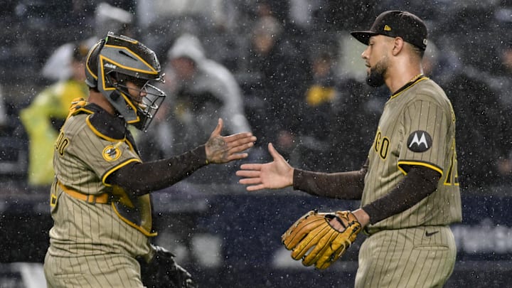 May 5, 2025; Bronx, New York, USA; San Diego Padres catcher Martín Maldonado (15) shakes hands with pitcher Robert Suarez (75) after defeating the New York Yankees at Yankee Stadium. Mandatory Credit: John Jones-Imagn Images