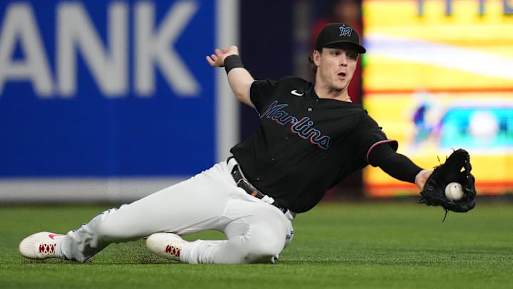 Miami Marlins right fielder Brian Anderson (15) slides to catch