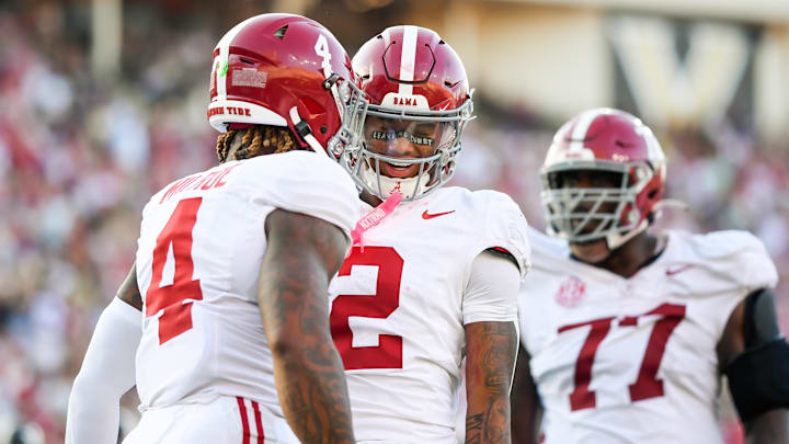 Oct 5, 2024; Nashville, Tennessee, USA;  Alabama Crimson Tide quarterback Jalen Milroe (4) and wide receiver Ryan Williams (2) celebrate the touchdown during the second half at FirstBank Stadium. Mandatory Credit: Steve Roberts-Imagn Images