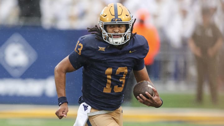 Sep 27, 2025; Morgantown, West Virginia, USA; West Virginia Mountaineers quarterback Jaylen Henderson (13) runs the ball during the first quarter against the Utah Utes at Milan Puskar Stadium. Mandatory Credit: Ben Queen-Imagn Images Sep 27, 2025; Morgantown, West Virginia, USA; West Virginia Mountaineers quarterback Jaylen Henderson (13) runs the ball during the first quarter against the Utah Utes at Milan Puskar Stadium. Mandatory Credit: Ben Queen-Imagn Images