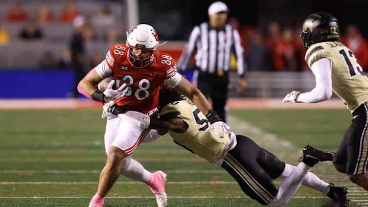 Oct 25, 2025; Salt Lake City, Utah, USA; Utah Utes tight end Dallen Bentley (88) is tackled by Colorado Buffaloes linebacker Reginald Hughes (50) after a catch during the third quarter at Rice-Eccles Stadium. Mandatory Credit: Rob Gray-Imagn Images Oct 25, 2025; Salt Lake City, Utah, USA; Utah Utes tight end Dallen Bentley (88) is tackled by Colorado Buffaloes linebacker Reginald Hughes (50) after a catch during the third quarter at Rice-Eccles Stadium. Mandatory Credit: Rob Gray-Imagn Images