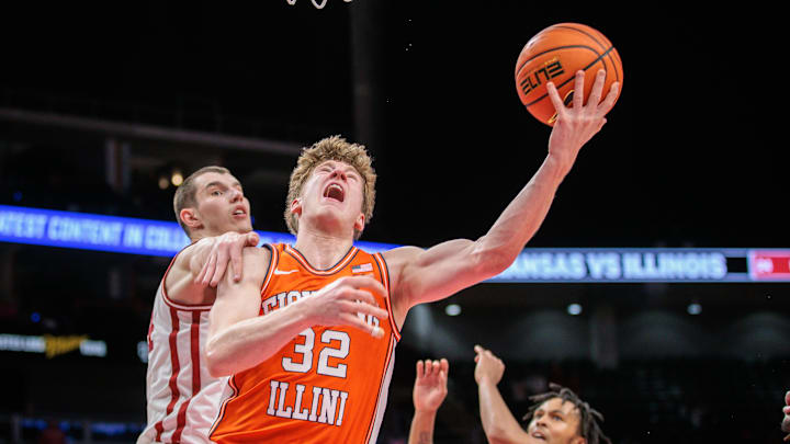 Nov 28, 2024; Kansas City, Missouri, USA; Illinois Fighting Illini guard Kasparas Jakucionis (32) drives to the basket during the second half against the Arkansas Razorbacks at T-Mobile Center. Mandatory Credit: William Purnell-Imagn Images Nov 28, 2024; Kansas City, Missouri, USA; Illinois Fighting Illini guard Kasparas Jakucionis (32) drives to the basket during the second half against the Arkansas Razorbacks at T-Mobile Center. Mandatory Credit: William Purnell-Imagn Images