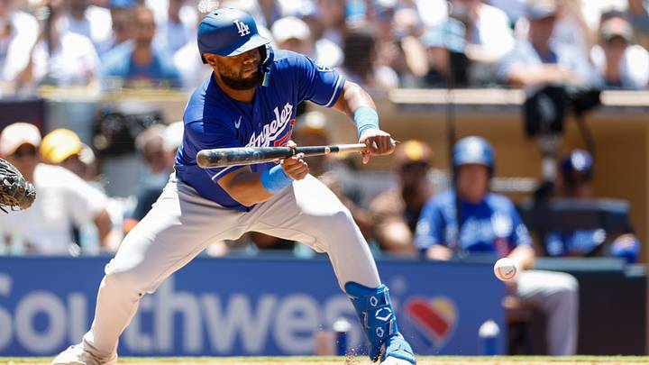 Los Angeles Dodgers catcher Chuckie Robinson (52) hits sacrifice bunt during the third inning against the San Diego Padres at Petco Park on June 28, 2026. Los Angeles Dodgers catcher Chuckie Robinson (52) hits sacrifice bunt during the third inning against the San Diego Padres at Petco Park on June 28, 2026.