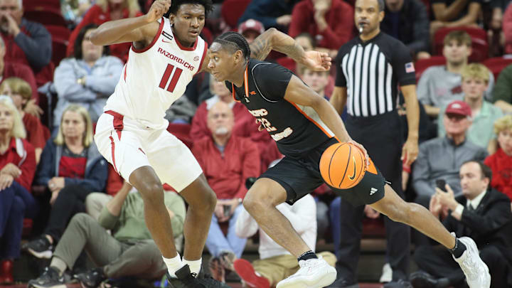 Nov 18, 2024; Fayetteville, Arkansas, USA; Arkansas Razorbacks forward Karter Knox (11) defends against Pacific Tigers guard Elijah Fisher (22) during the second half at Bud Walton Arena. Arkansas won 91-72. Mandatory Credit: Nelson Chenault-Imagn Images