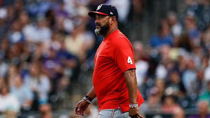 Jun 21, 2024; Denver, Colorado, USA; Washington Nationals manager Dave Martinez (4) walks to the mound in the fourth inning against the Colorado Rockies at Coors Field.
