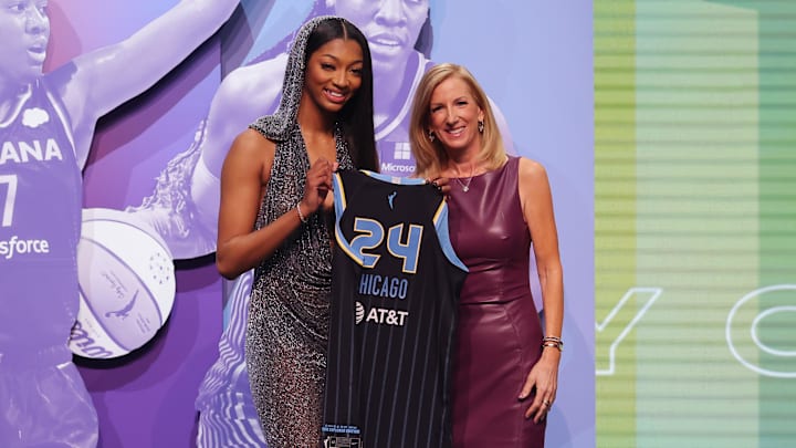 Angel Reese poses with WNBA commissioner Cathy Engelbert.