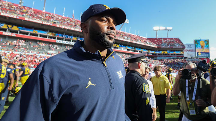 Dec 31, 2024; Tampa, FL, USA; Michigan Wolverines head coach Sherrone Moore celebrates after beating the Alabama Crimson Tide in the ReliaQuest Bowl at Raymond James Stadium. Mandatory Credit: Nathan Ray Seebeck-Imagn Images
