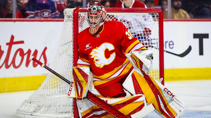 Mar 8, 2025; Calgary, Alberta, CAN; Calgary Flames goaltender Dustin Wolf (32) guards his net against the Montreal Canadiens during the first period at Scotiabank Saddledome. Mandatory Credit: Sergei Belski-Imagn Images